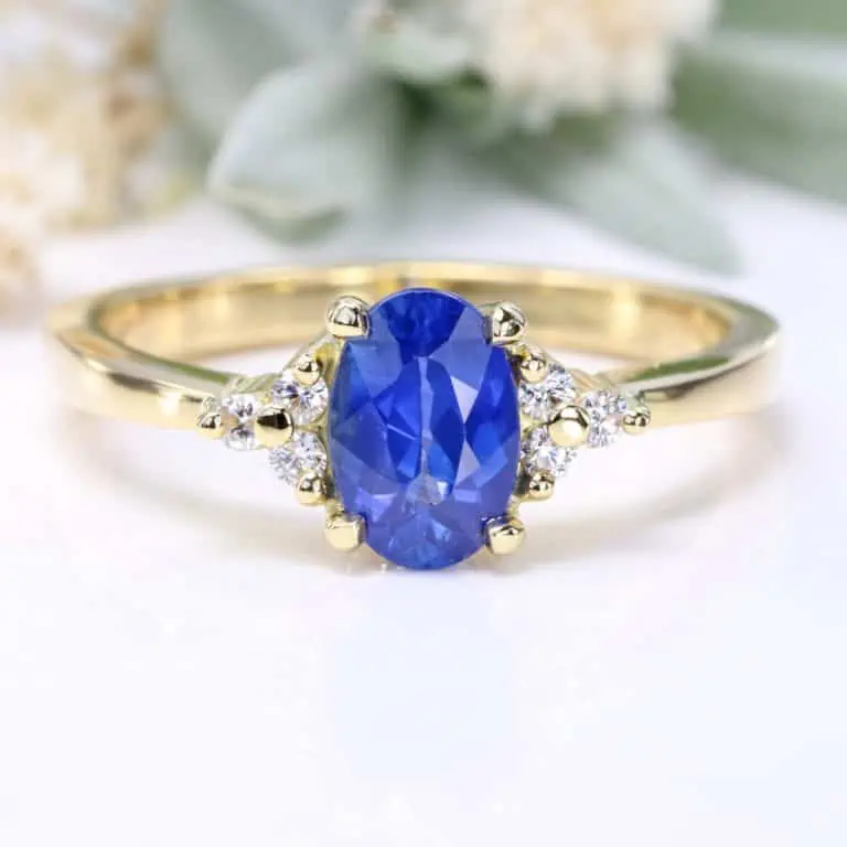 oval blue sapphire diamond cluster engagement ring 18ct gold e 1100x1100 1 768x768 1