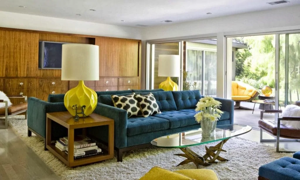 mid century home design with vibrant pops of color and beautiful wood textured furniture